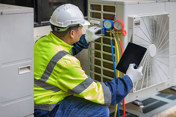 Professional Emergency Ac Repair technician working in Rossville, GA